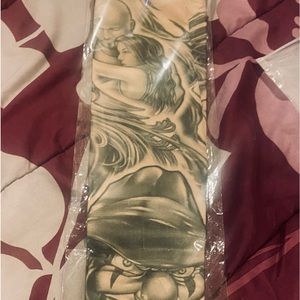 Unisex GoD tattoos sleeves with clown and ladies face.